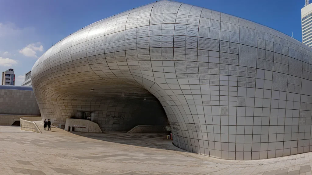 Dongdaemun Design Plaza at night with traditional Korean architecture